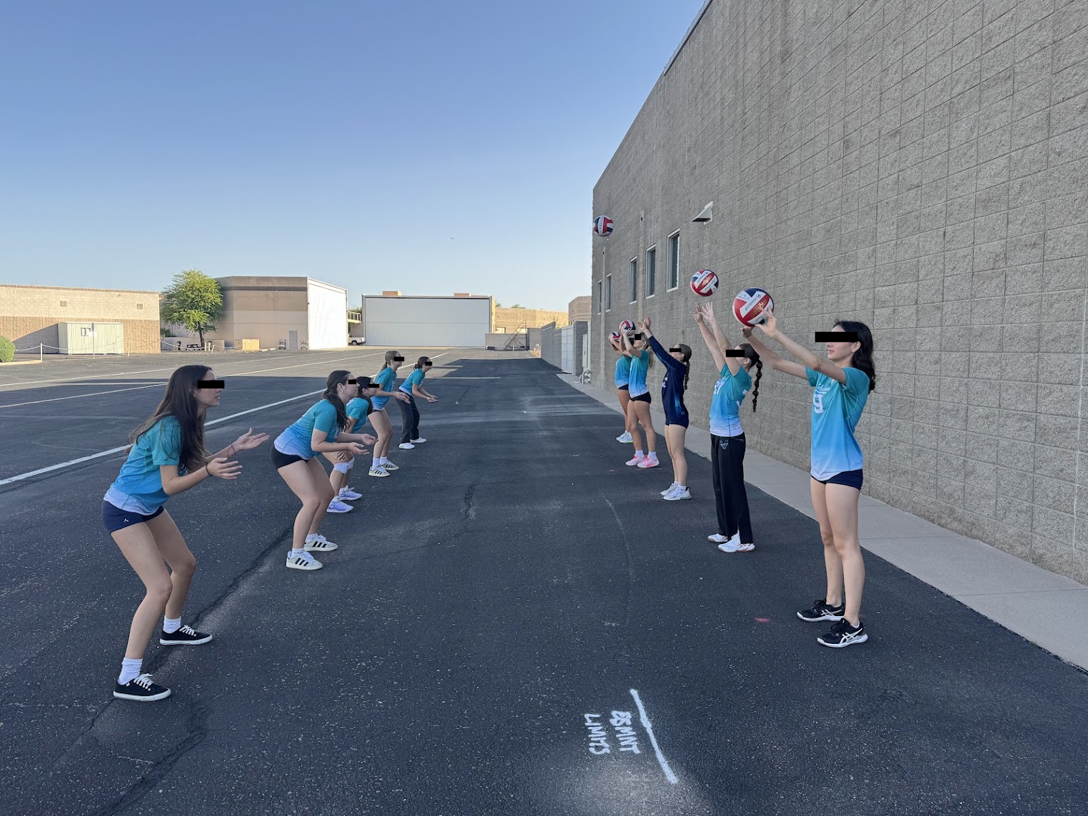 Players working on a passing drill outdoors